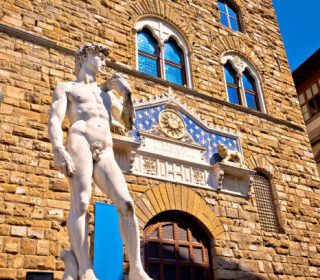 Piazza della Signoria statue of David by Michelangelo and Palazzo Vecchio of Florence view, Tuscany region of Italy