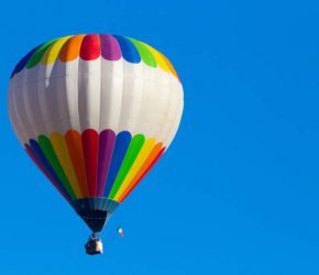 Multi colored hot air balloon at Mondovì, Piedmont, Italy.