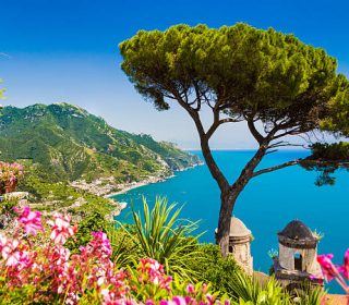 Scenic picture-postcard view of famous Amalfi Coast with Gulf of Salerno from Villa Rufolo gardens in Ravello, Campania, Italy.