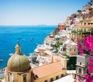 view of Positano with flowers - famous old italian resort, Italy